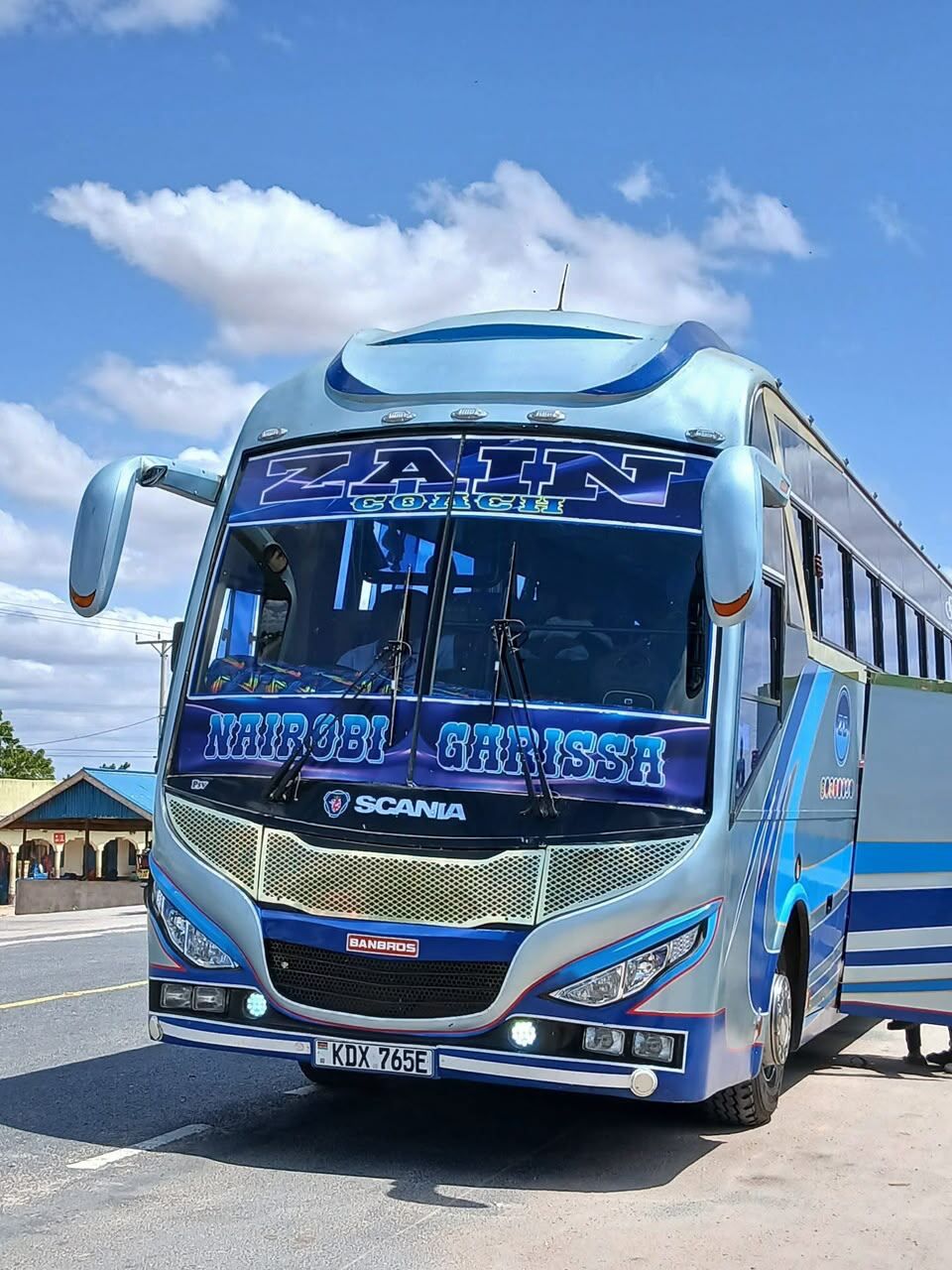Zain Coach bus windshield with illuminated ZAIN lettering