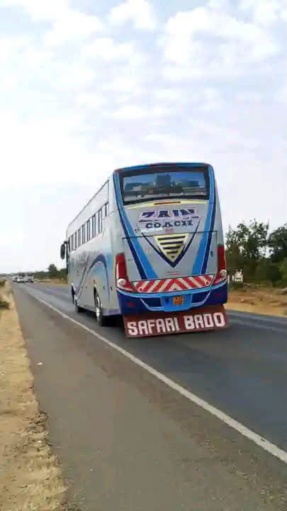 Zain Coach bus rear view on the open road